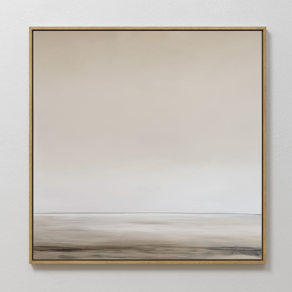 The Morning Mist Abstract Canvas Art features neutral tones, a blurred horizon, and a thin golden frame for modern elegance, creating a minimalist look as it hangs on a white wall.