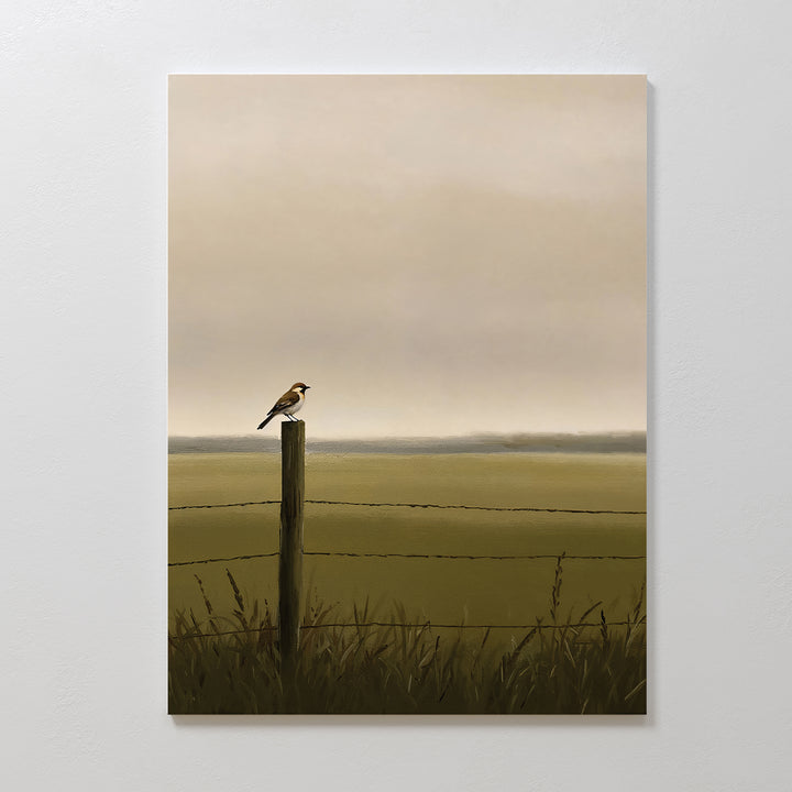 Morning Perch Canvas Art features a small bird resting on a wooden fence post before a wire fence and grassy field under cloudy skies, creating serene minimalist wall decor ideal for earthy interior spaces.