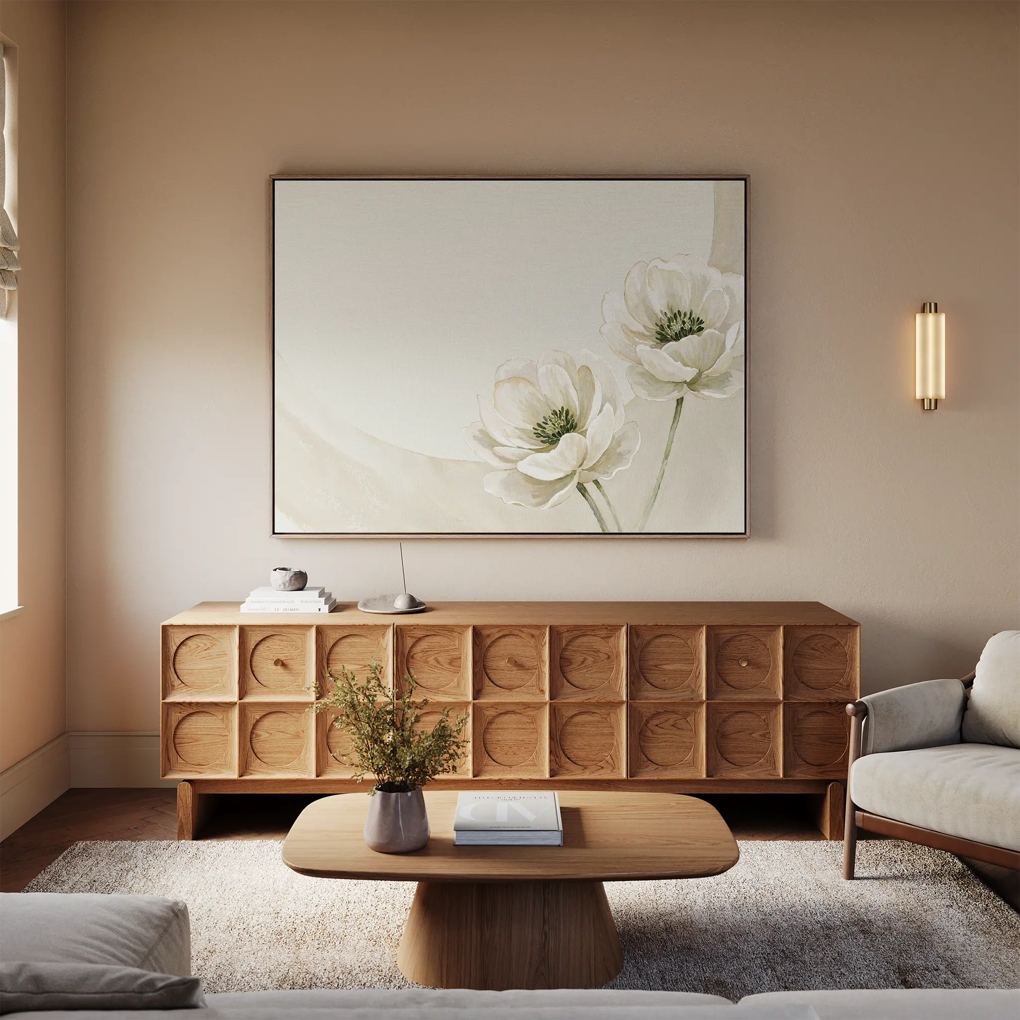 A minimalist living room with a wooden sideboard, beige sofa, and light wood coffee table displays neutral walls accented by the Morning Petals Canvas Art and a small floral vase on the coffee table.