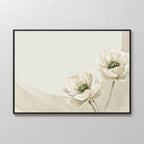 The Morning Petals Canvas Art features two white flowers with green centers on pale stems, set against a light beige background with curved accents. Framed in black, this minimalist floral wall art brightens any light-colored wall.