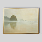 The Morning At Cannon Beach Canvas Art showcases misty beaches, ocean rock formations, gentle waves, and wet sand reflecting the scenery in soft beige and gray tones, capturing a tranquil coastal atmosphere.