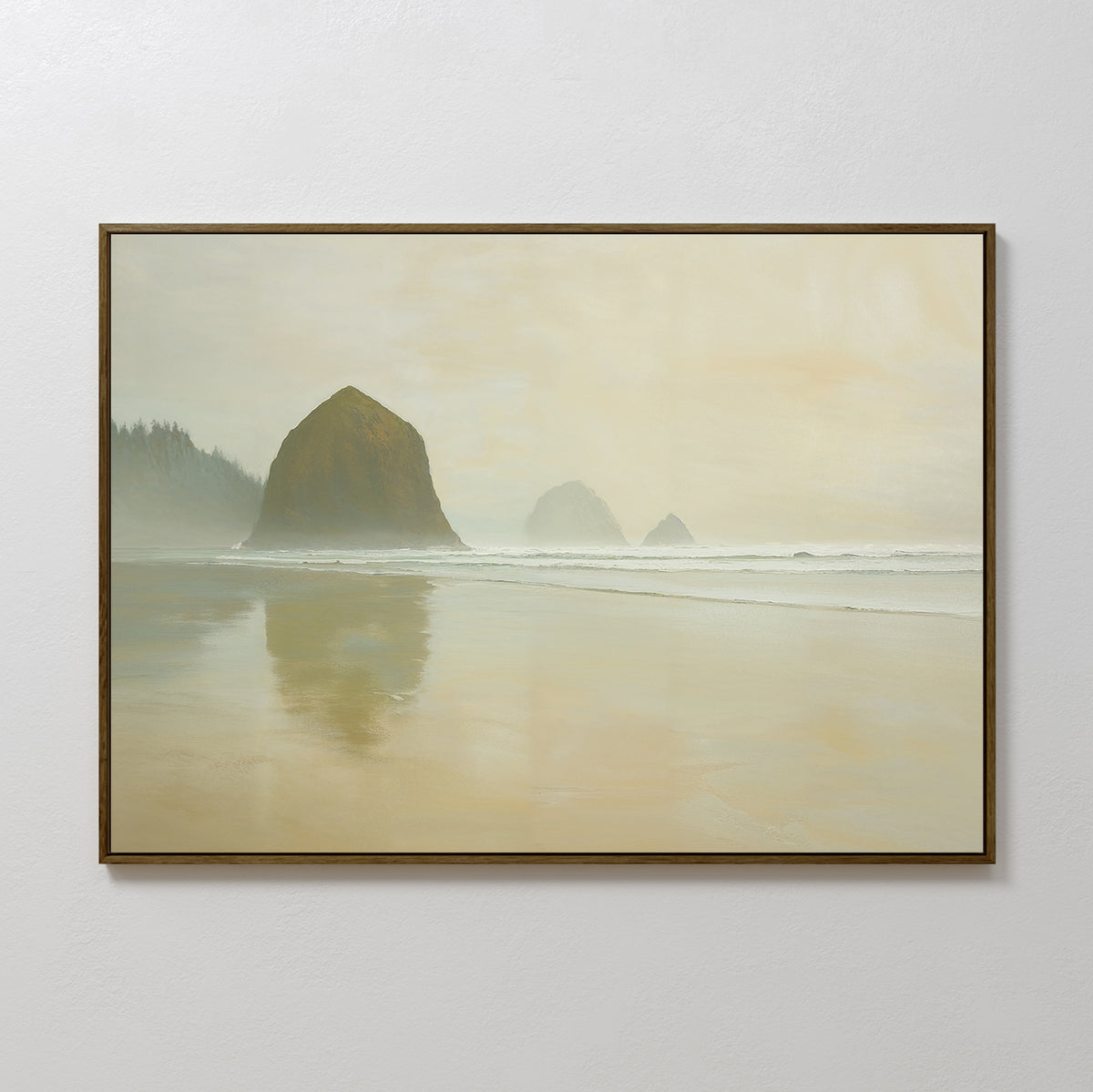 The Morning At Cannon Beach Canvas Art features a misty beach scene with large rocks, gentle waves, and a hazy sky—capturing the serene coastal atmosphere and tranquil shoreline reflections.