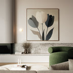 A modern living room features a green armchair, a low marble shelf with a vase of dried branches, and the Muted Elegance Canvas Art on a pale wall. A round coffee table displays books and candles.