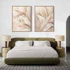 A modern bedroom features a green upholstered bed with white bedding, two Natural Texture Set of 2 nightstands with beige lamps, minimalist wall decor above the headboard, and a patterned area rug on a light wooden floor.