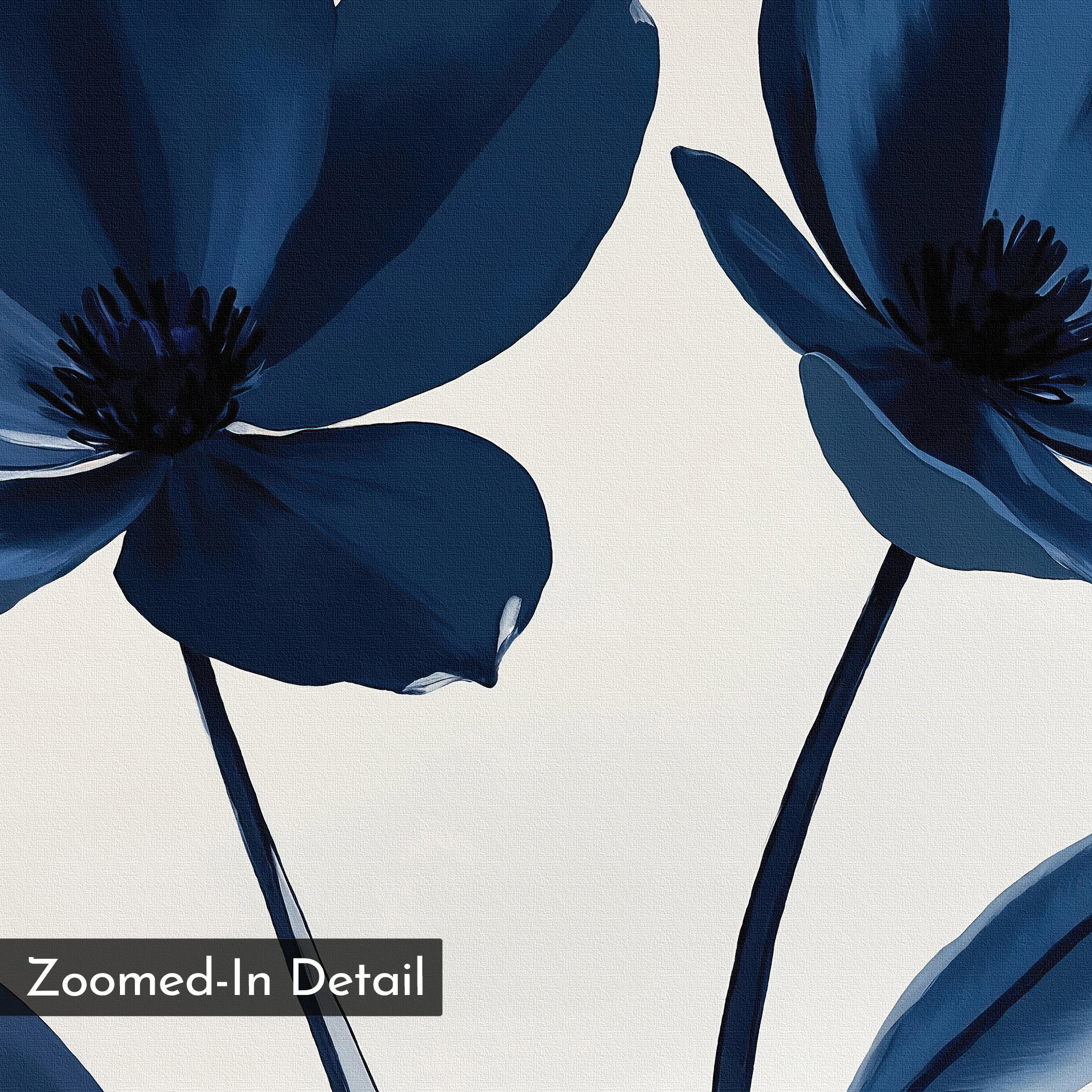 A close-up of two dark blue flowers with black centers on light stems appears on the Navy Flora Canvas Art. Set against a white background, it features a "Zoomed-In Detail" label in a black box at the bottom left corner.
