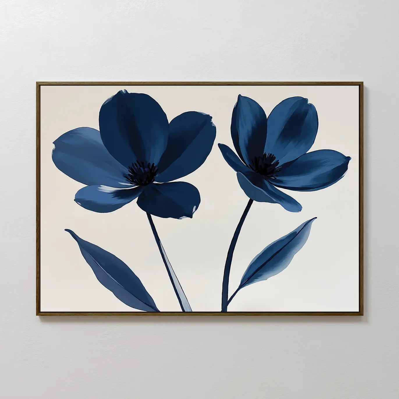 The Navy Flora Canvas Art is a framed minimalist print featuring two blue flowers with dark centers and long leaves on a neutral background, perfect as large wall decor for a white wall.