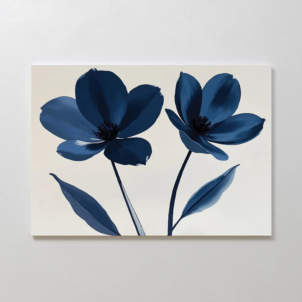The Navy Flora Canvas Art showcases a minimalist floral print with two large blue flowers and long stems on a neutral background—ideal as navy wall art for large wall decor.