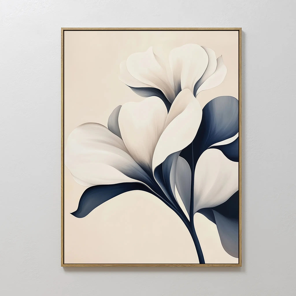 Navy Magnolia Canvas Art features abstract white flowers with dark blue leaves on a light beige background, framed in thin gold—a perfect minimalist wall art piece to enhance your living room or bedroom decor.