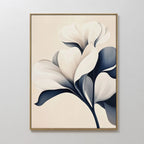 Navy Magnolia Canvas Art features abstract white flowers with dark blue leaves on a light beige background, framed in thin gold—a perfect minimalist wall art piece to enhance your living room or bedroom decor.