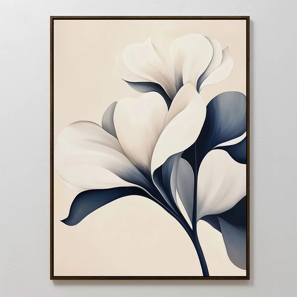 Navy Magnolia Canvas Art features a flower with large white petals and deep blue leaves on a light beige background. Displayed in a sleek thin frame, it’s ideal minimalist wall art to enhance your living room decor.