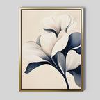 Navy Magnolia Canvas Art features a white flower with bold petals and dark leaves on a light beige background. Framed in thin gold, it brings refined beauty to any bedroom or living room decor.