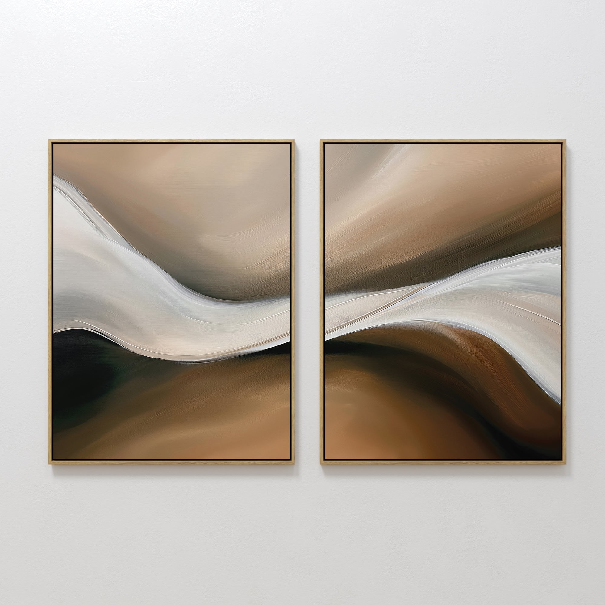 The Neutral Landscape River Set of 2 features abstract wall art with fluid, wavy shapes in beige, brown, cream, and black, framed in gold. These minimalist pieces add movement and a modern touch, perfect for neutral living room decor.