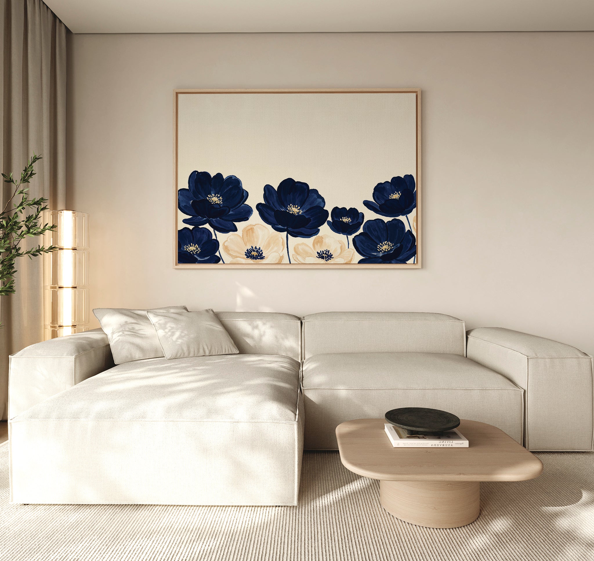 A modern living room with a beige sectional, light wood coffee table, floor lamp, and the Nightshade Canvas Art – Horizontal featuring blue and cream florals. Neutral tones and minimal decor create a calm ambiance.