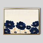 The Nightshade Canvas Art – Horizontal features dark blue and cream flowers with yellow centers along the bottom on a light beige background. A gold frame enhances the minimalist, modern floral design for a sophisticated touch.