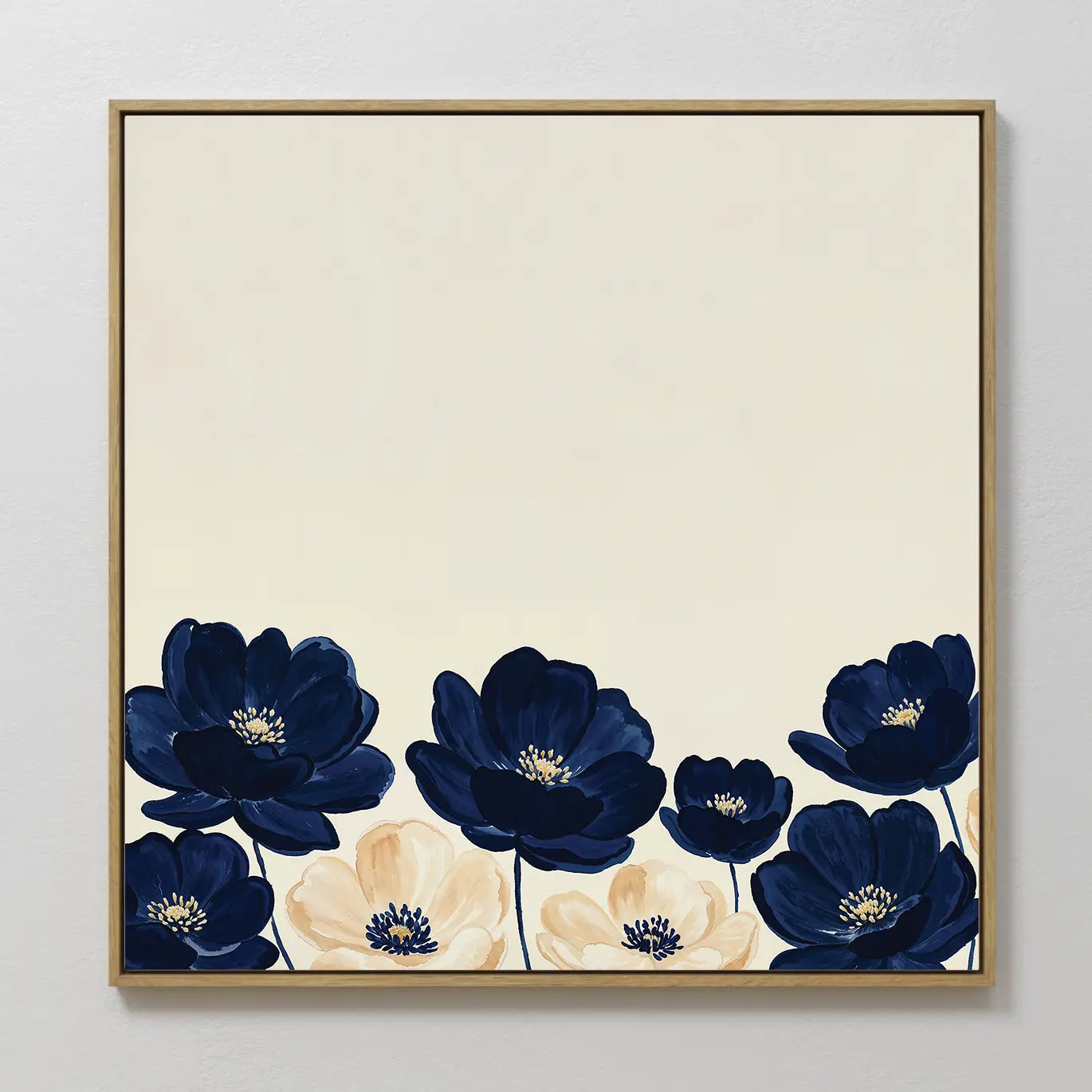 Nightshade Canvas Art: A square, minimalist wall piece featuring dark blue and cream flowers with green stems along the bottom edge, set against a plain light background.