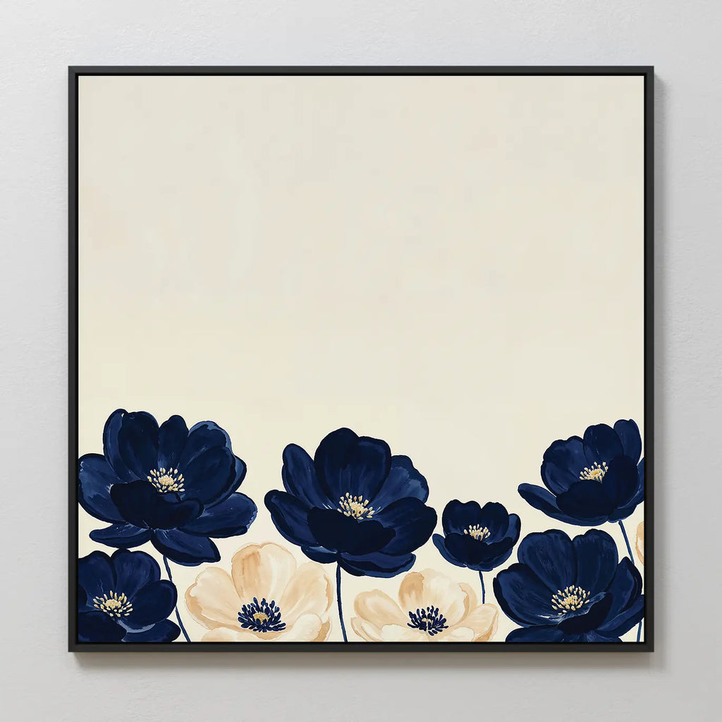 The Nightshade Canvas Art is a square, modern wall piece showcasing dark blue and cream flowers with dark centers along the bottom edge set against a plain light beige background.