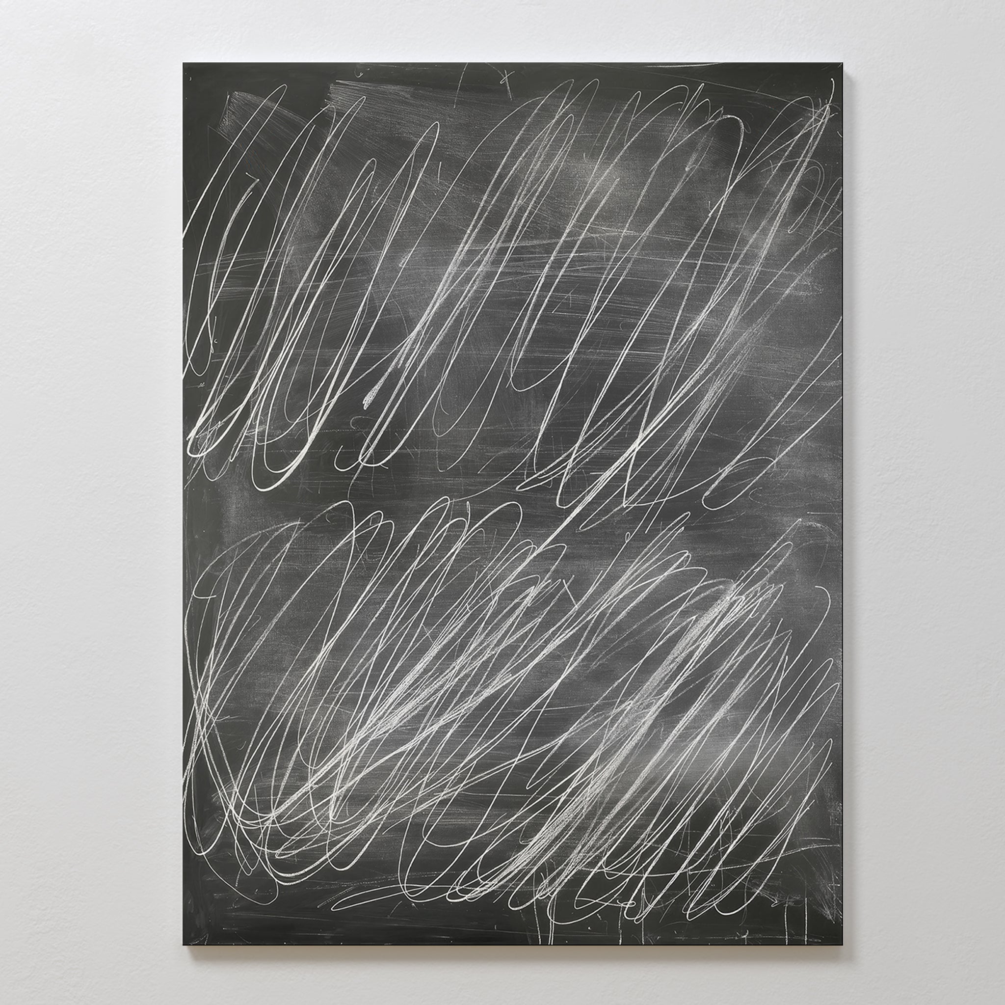 Echoes in Chalk Abstract Canvas Art features a blackboard-style design on a white background with bold, overlapping white chalk swirls. No clear words or drawings appear, giving it a striking, minimalist modern wall art look for any space.