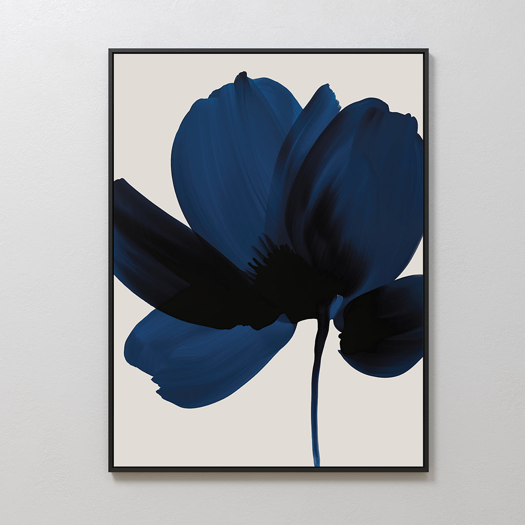 Nocturne Blossom Canvas Art features a large, abstract dark blue flower with bold brushstrokes on a light beige background, framed in black—ideal minimalist wall decor for modern living rooms.