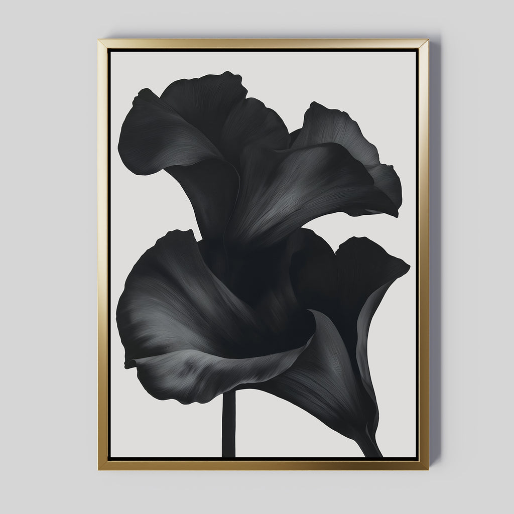 The Noir Bloom Abstract Canvas Art features two bold black abstract flowers with flowing petals on a light gray background. A gold frame with a slim black inner border adds a modern touch, making it ideal wall art for any living room.