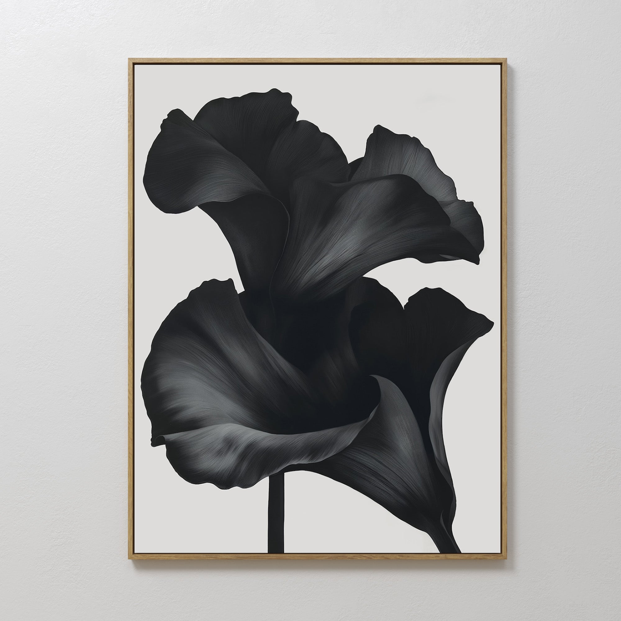 The Noir Bloom Abstract Canvas Art features two dark, abstract flower petals on a white background, creating striking minimalist wall decor ideal for enhancing any modern living room.