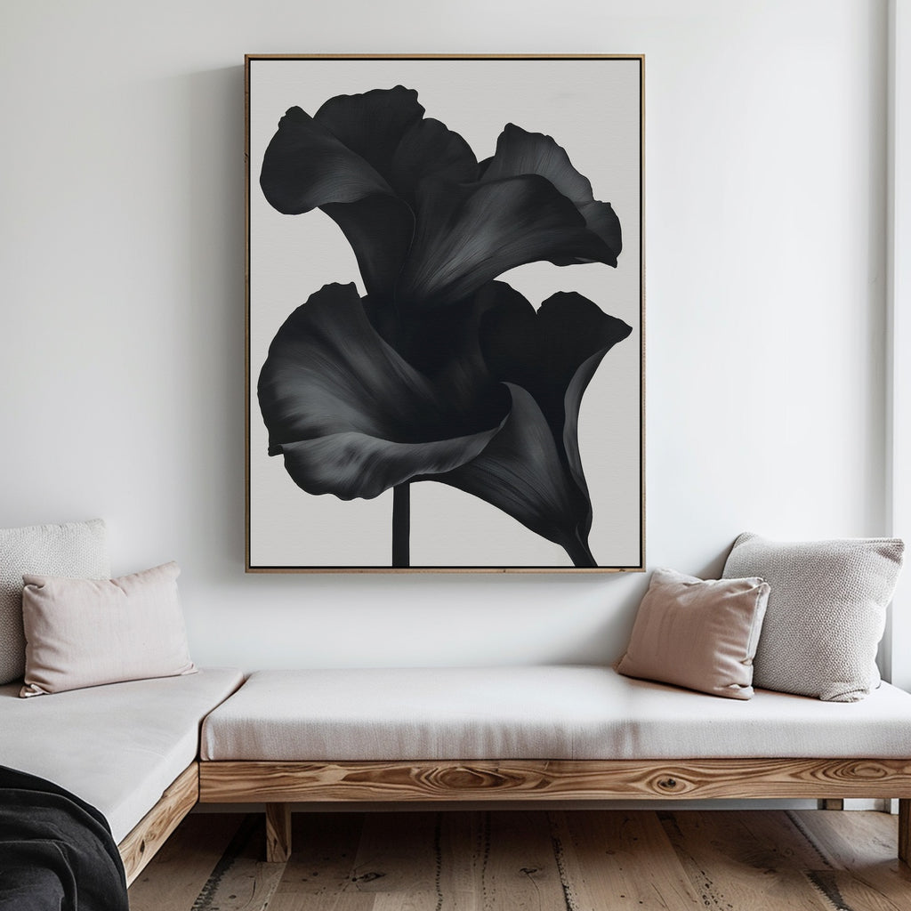A minimalist living room featuring a wooden bench, beige cushions, and the Noir Bloom Abstract Canvas Art—a large framed black-and-white floral piece—adds a stylish touch to the white wall.