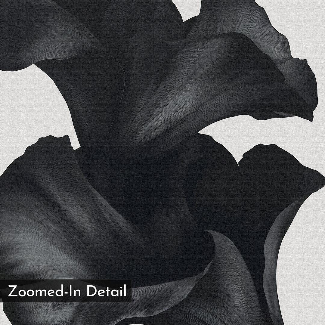 Close-up of black, abstract flower petals with smooth texture set against a light background. This minimalist wall art, titled Noir Bloom Canvas Art - Square, features a Zoomed-In Detail label in the lower left corner.