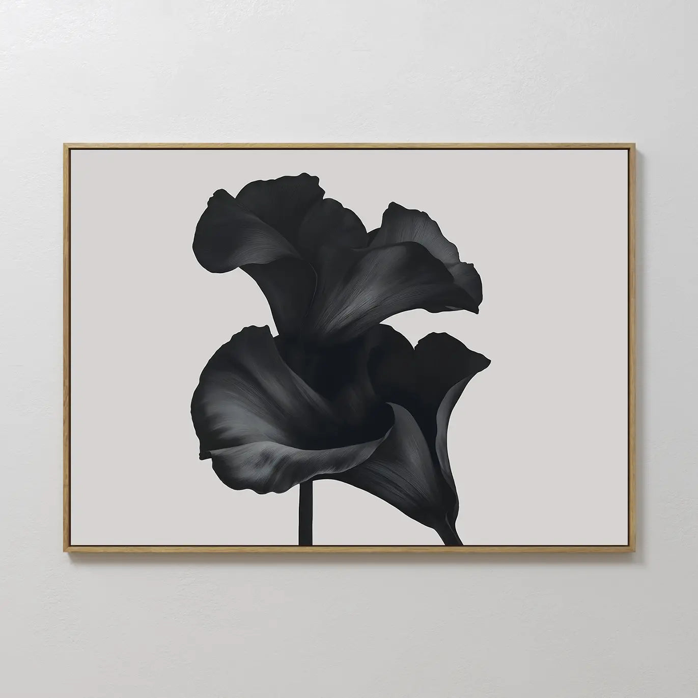 Noir Bloom Canvas Art – Horizontal features two large black calla lilies with overlapping petals on a light gray background, framed in slim gold—an ideal minimalist wall art piece for modern living room decor.