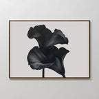 Noir Bloom Canvas Art – Horizontal is a framed minimalist wall piece showcasing two dark, stylized calla lilies with soft curved petals on a light gray background—ideal for modern living room decor.