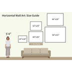 Illustration of a 5'4" woman by a sofa with five framed wall art sizes—including the popular Dune Whispers Canvas Art - Horizontal—shown as a coastal landscape artwork size guide above the sofa.