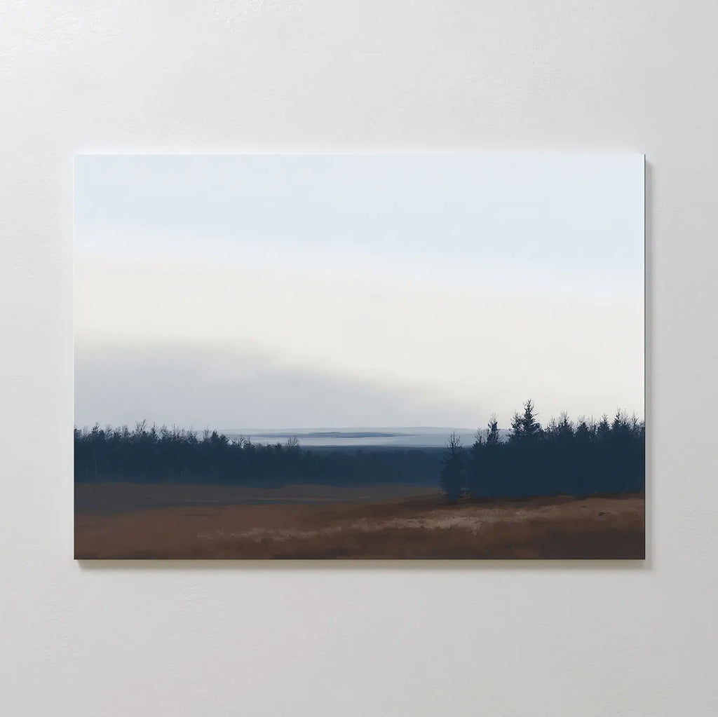 The Northern Woods Canvas Art displays a minimalist brown field, dark evergreen trees evoking a Nordic park, and a pale cloudy sky, elegantly hung on a plain white wall.