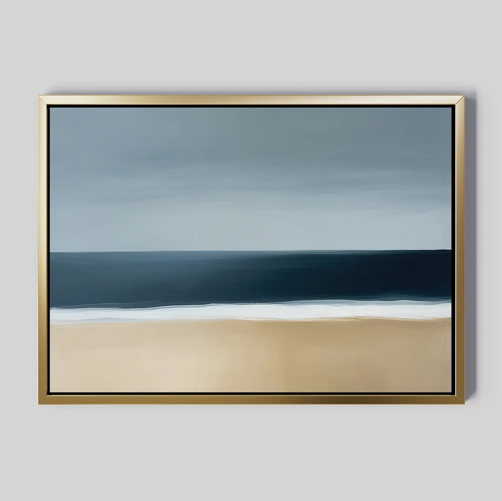 The Ocean Edge Canvas Art – Horizontal features a calm seascape with a sandy beach, dark blue ocean, gentle white waves, and a cloudy gray sky on a light gray background. Ideal as large wall art for any serene space.
