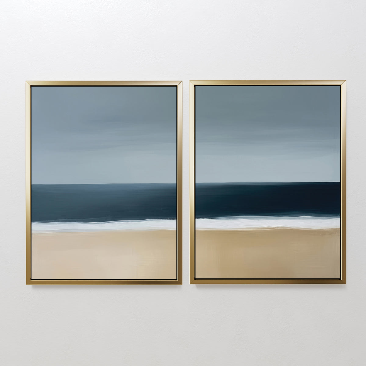 The Ocean Edge Set of 2 features framed abstract seascapes with blue sky, dark ocean, and beige sand—ideal minimalist wall art for a serene living room, showcasing soft lines and muted tones.