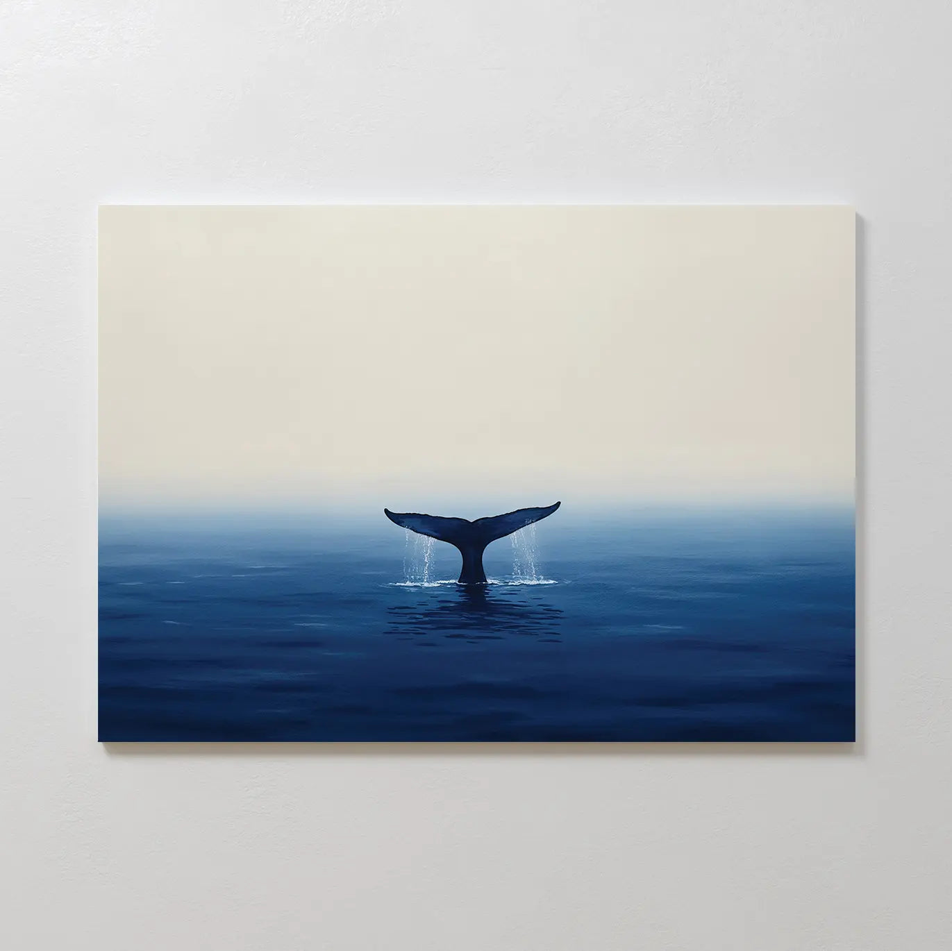 Ocean Giant Canvas Art features a minimalist seascape of a whale’s tail in deep blue water beneath a pale sky—ideal coastal wall decor for creating tranquility in any space.