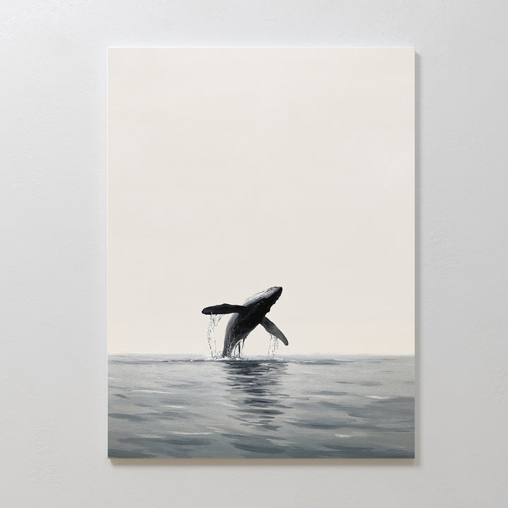 Ocean Leap Canvas Art features a minimalist whale breaching over calm water with gentle reflections on a neutral background—ideal as large wall art for creating a serene, modern atmosphere.