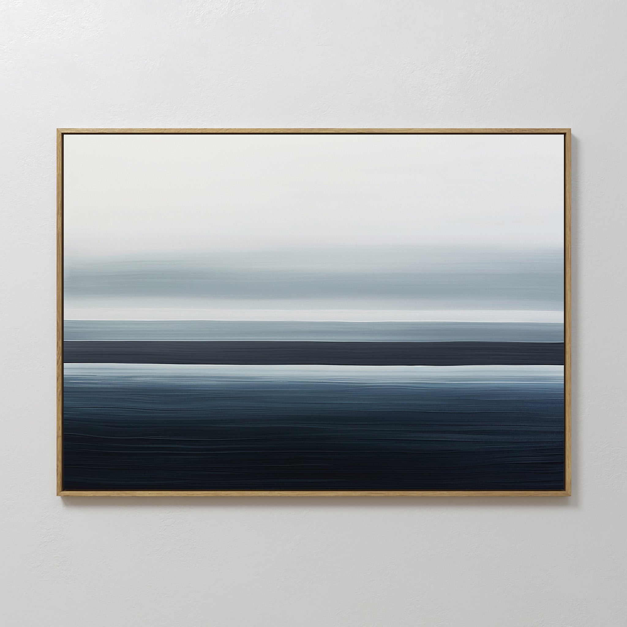 The Oceanic Blur Canvas Art – Horizontal features blue, gray, and white bands for a serene, coastal touch—perfect for minimalist decor on light-colored walls.