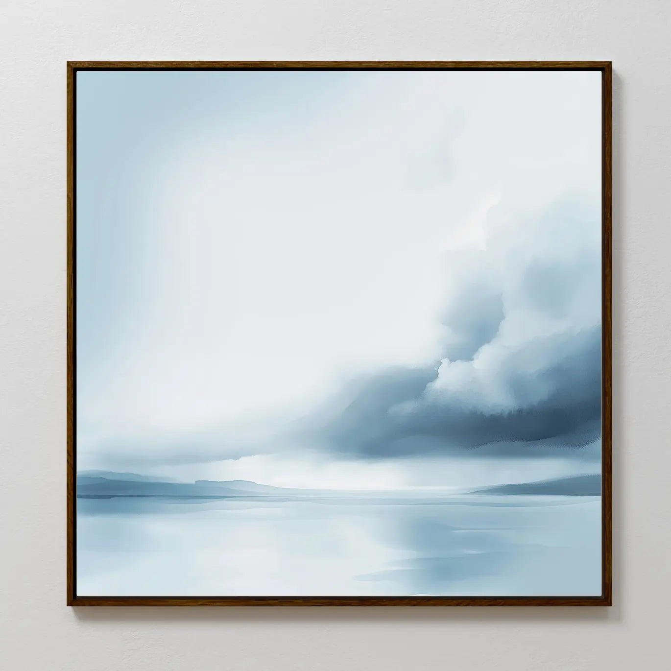 The Oceanic Overcast Canvas Art features a serene seascape with calm waters, distant hills, and a cloudy sky in soft blue and white tones—perfect minimalist wall art to create a calming atmosphere in any space.