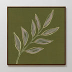 Olive Branch Canvas Art features a minimalist leafy branch with elongated leaves on an olive green background. Shades of gray and beige add subtle elegance, making it perfect large wall art for modern living room decor.