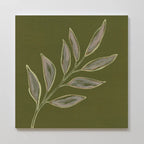 Olive Branch Canvas Art features a minimalist leafy branch with ten subtle gray-green leaves on an olive background—ideal botanical wall decor to complement modern living rooms with clean lines and muted tones.