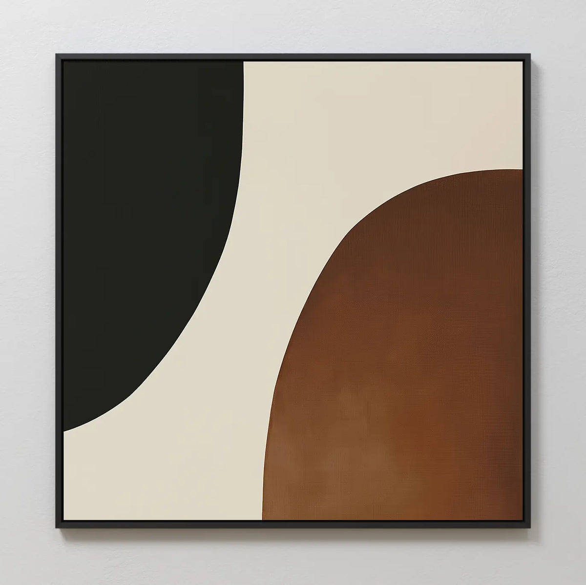 The Organic Balance Canvas Art features a cream background with bold, curved black and brown shapes meeting at the center. This minimalist, geometric wall art comes in a sleek black frame—ideal for any modern, neutral living room decor.