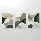 The Organic Flow Set of 3 features abstract paintings with overlapping organic shapes in muted green, beige, and white tones, displayed side by side for a modern look.