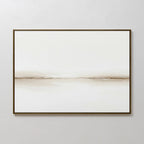 Pale Desert Canvas Art showcases a minimalist, horizontal beige line on a white canvas in a slim dark frame—ideal for contemporary living room decor and perfect on light grey walls.