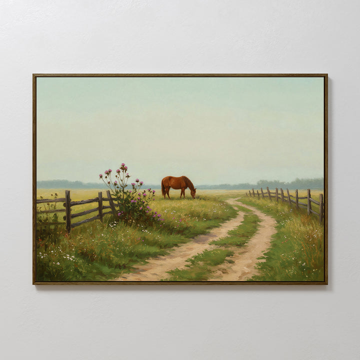 The Pasture Path Canvas Art features a dirt path through a grassy field, a brown horse grazing by a wooden fence, and wildflowers blooming beneath a pale blue sky.
