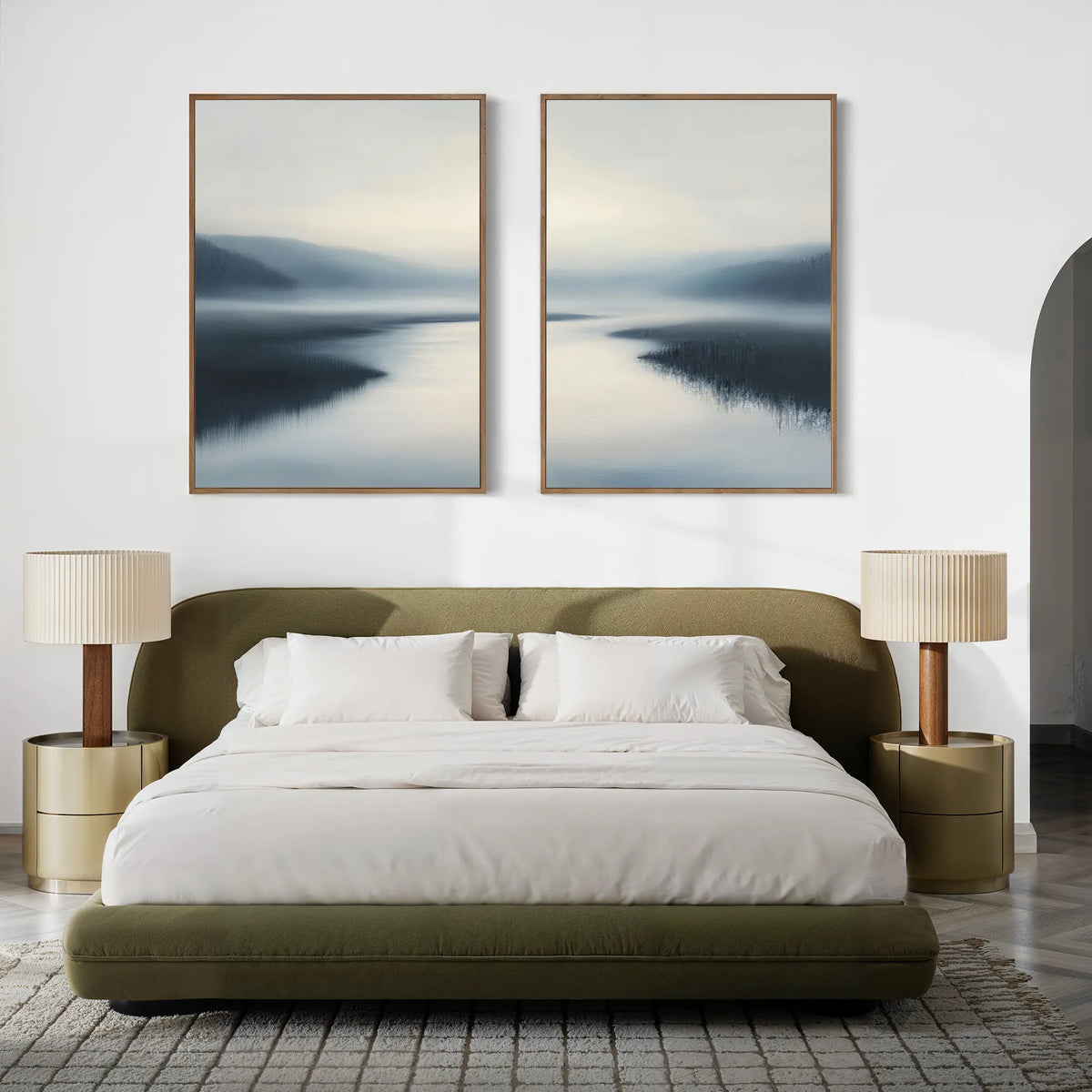 Modern bedroom with an olive green upholstered bed, white bedding, beige nightstands with matching lamps, and the Peaceful Waters Set of 2 landscape wall art above the bed. Neutral tones and minimalist design create a tranquil atmosphere.