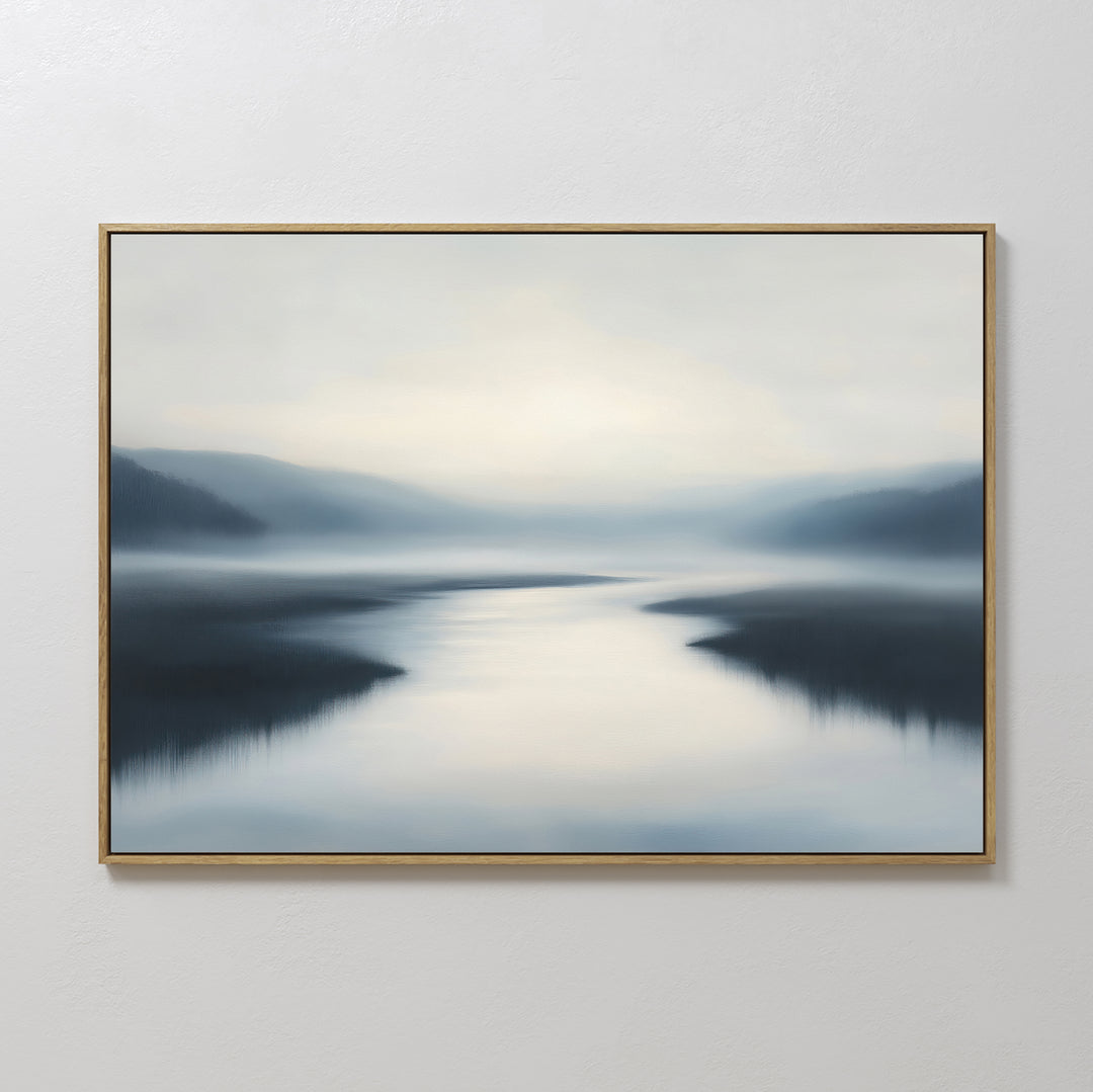 The Peaceful Waters Canvas Art – Horizontal features calm water reflecting soft light with blurred hills and a hazy blue, gray, and white sky—ideal calming landscape wall art for a tranquil living room.