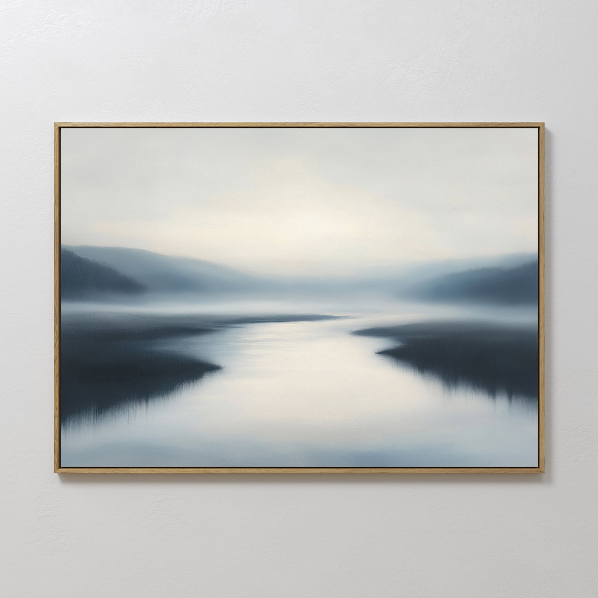 The Peaceful Waters Canvas Art – Horizontal features calm water reflecting soft light with blurred hills and a hazy blue, gray, and white sky—ideal calming landscape wall art for a tranquil living room.