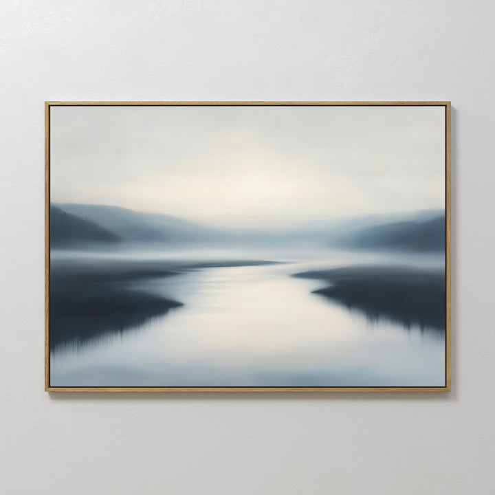 The Peaceful Waters Canvas Art – Horizontal features calm water reflecting soft light with blurred hills and a hazy blue, gray, and white sky—ideal calming landscape wall art for a tranquil living room.