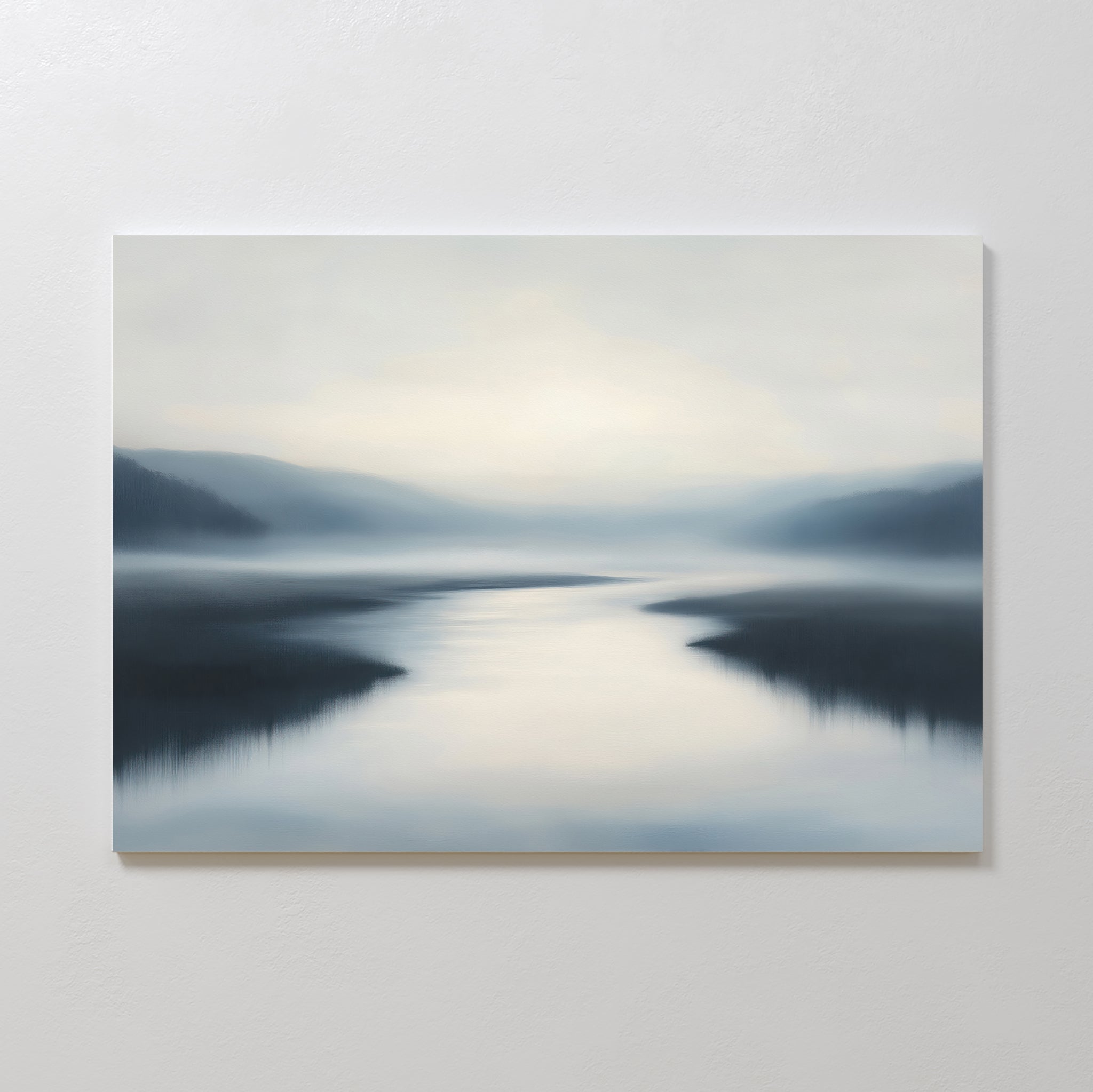 The Peaceful Waters Canvas Art – Horizontal features a calm, misty river winding through soft hills in muted blue and gray tones, creating serene landscape wall art ideal for tranquil living room decor.