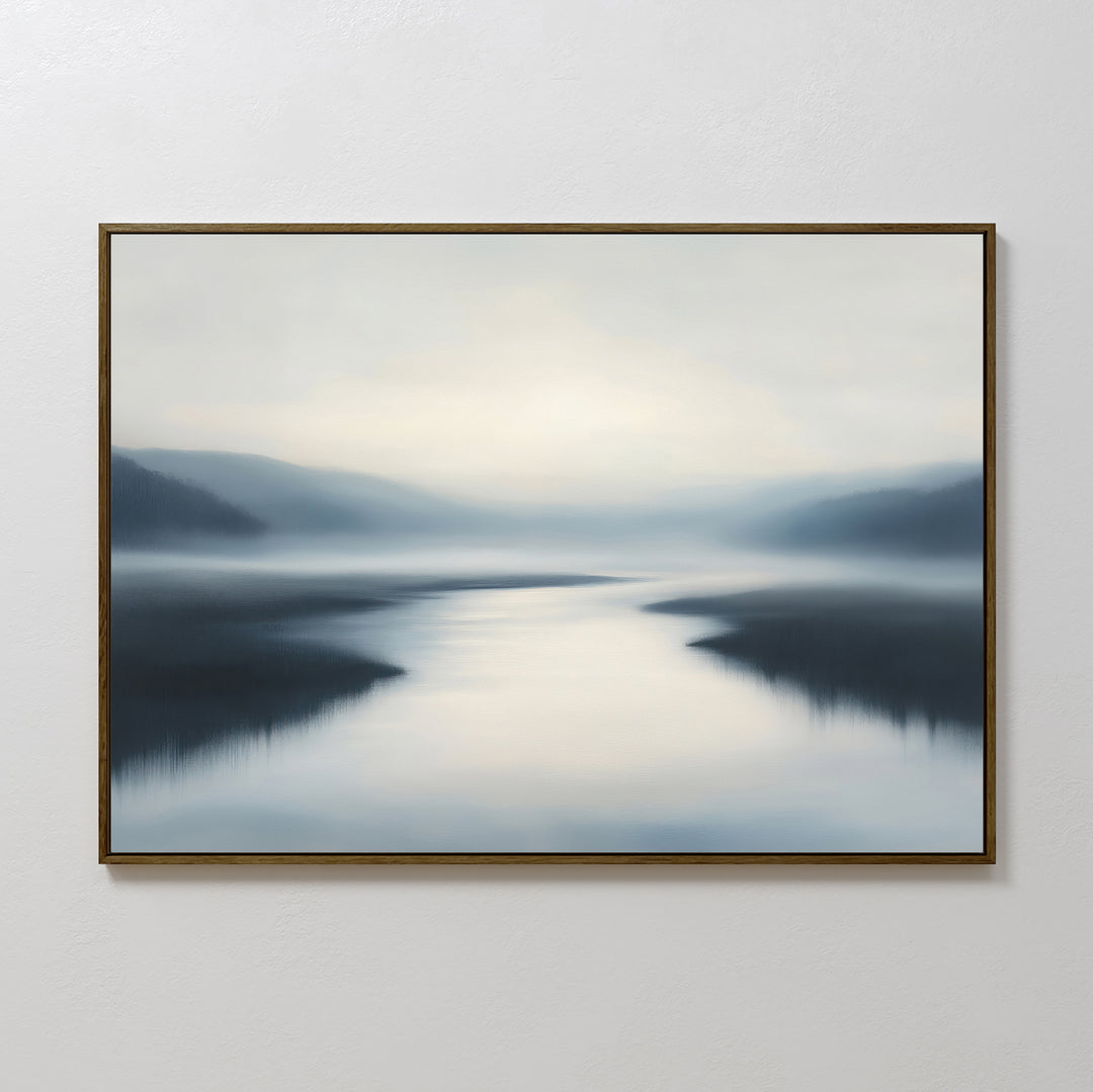 The "Peaceful Waters Canvas Art – Horizontal," featuring a serene misty landscape in cool blue and gray tones, adds tranquil beauty to your living room as calming landscape wall art on any blank white wall.