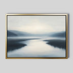 The Peaceful Waters Canvas Art – Horizontal features a serene misty landscape with a winding river and gentle hills in cool blues and grays, adding a tranquil touch to any living room decor.