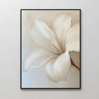 The Pure Magnolia Canvas Art features a large, cream-colored magnolia with soft petals and smooth shading on a minimalist background—ideal for bedroom decor and displayed framed against a light beige wall.